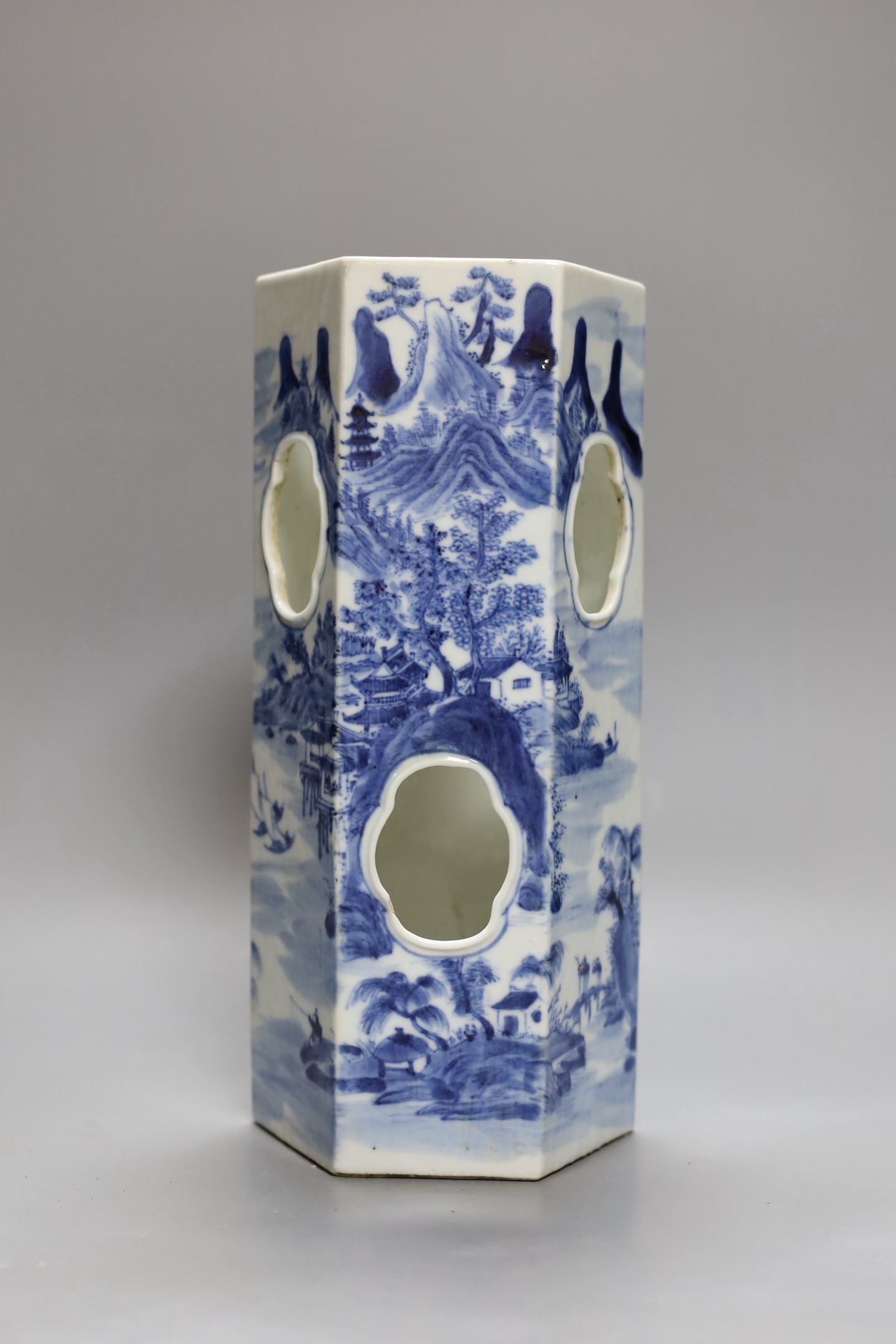 A Chinese blue and white hexagonal hat stand, late 19th century, 27.5 cms high, 27.2 cm high, hairline crack to one side of body